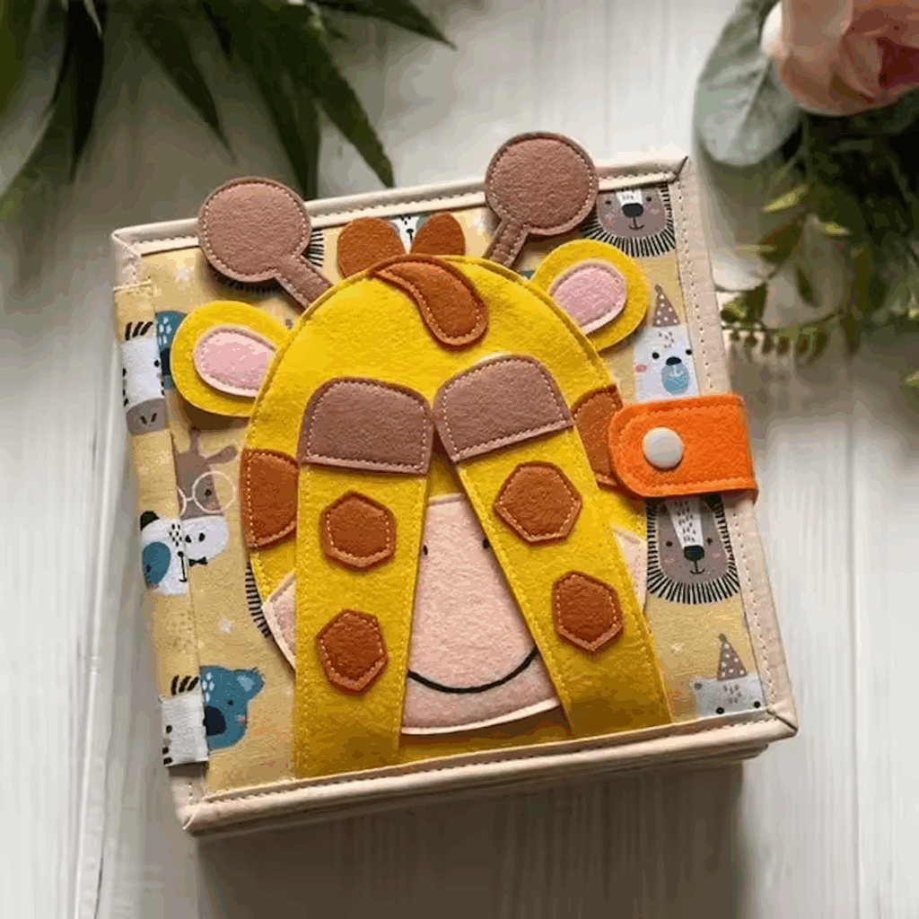 Front Cover of Giraffe Busy Book - eyes closed