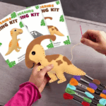 DIY felt dinosaur sewing kit for kids with pre-cut pieces, threads, and accessories